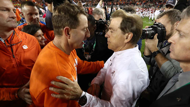 Clemson Tigers head coach Dabo Swinney meets with Alabama Crimson Tide head coach Nick Saban