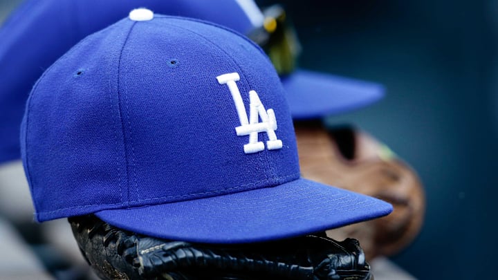 Apr 9, 2017; Denver, CO, USA; A general view of a Los Angeles Dodgers hat and glove on the bench in the seventh inning of the game against the Colorado Rockies at Coors Field. Mandatory Credit: Isaiah J. Downing-Imagn Images