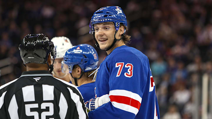 Sep 24, 2024; New York, New York, USA; New York Rangers center Matt Rempe (73) speaks with a linesman  during the second period against the New York Islanders at Madison Square Garden. Mandatory Credit: Danny Wild-Imagn Images
