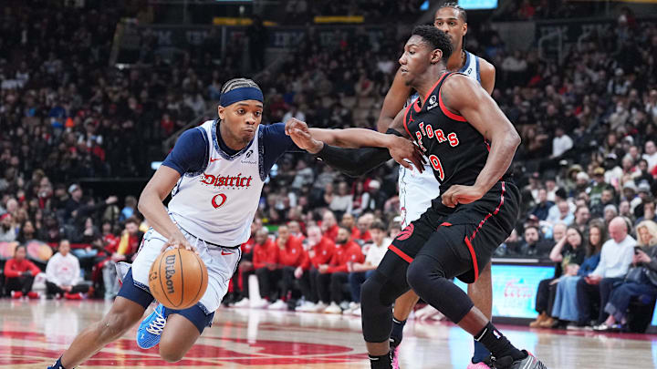 Mar 8, 2025; Toronto, Ontario, CAN; Washington Wizards guard Bilal Coulibaly (0) controls the ball as Toronto Raptors guard RJ Barrett (9) tries to defend during the first quarter at Scotiabank Arena. Mandatory Credit: Nick Turchiaro-Imagn Images Mar 8, 2025; Toronto, Ontario, CAN; Washington Wizards guard Bilal Coulibaly (0) controls the ball as Toronto Raptors guard RJ Barrett (9) tries to defend during the first quarter at Scotiabank Arena. Mandatory Credit: Nick Turchiaro-Imagn Images