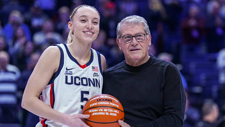 Jan 22, 2025; Storrs, Connecticut, USA; UConn Huskies guard Paige Bueckers (5) is recognized with head coach Geno Auriemma for her 2000 career points before the start of the game against the Villanova Wildcats at Harry A. Gampel Pavilion. Mandatory Credit: David Butler II-Imagn Images