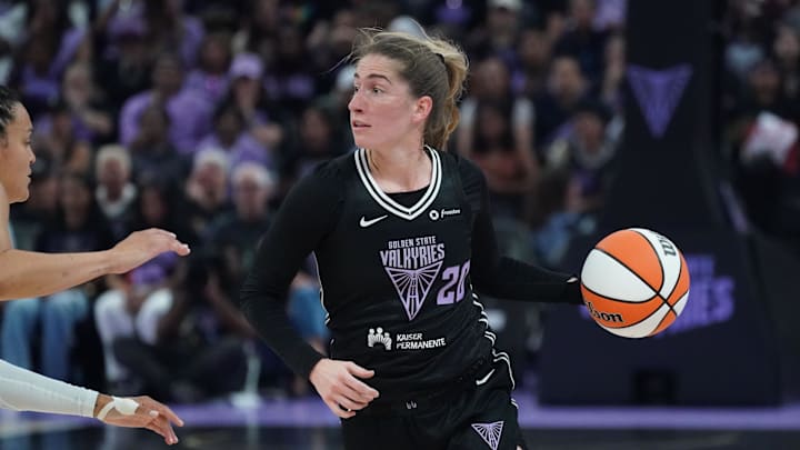 Golden State Valkyries guard Kate Martin (20) looks to pass while guarded by Minnesota Lynx guard Kayla McBride (21) in the second quarter at Chase Center. 