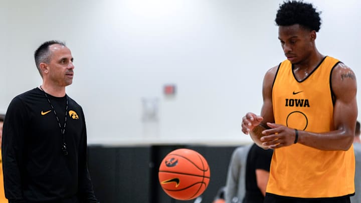 Iowa men’s basketball head coach Ben McCollum talks to Tavion Banks (6) as he prepares to shoot a free throw during practice June 19, 2025 at Carver-Hawkeye Arena in Iowa City, Iowa.