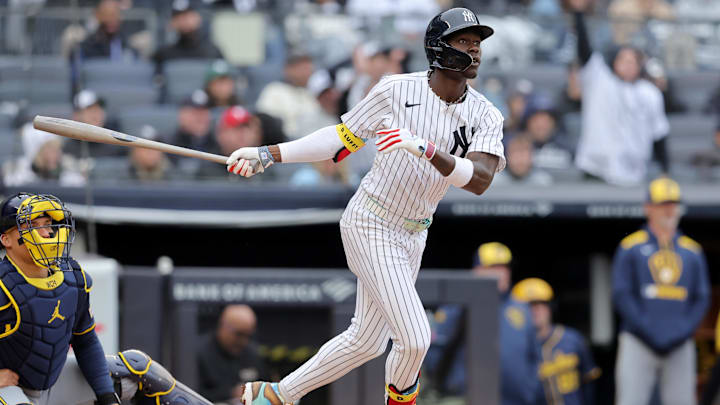 Mar 30, 2025; Bronx, New York, USA; New York Yankees second baseman Jazz Chisholm Jr. (13) follows through on a two run home run against the Milwaukee Brewers during the third inning at Yankee Stadium.