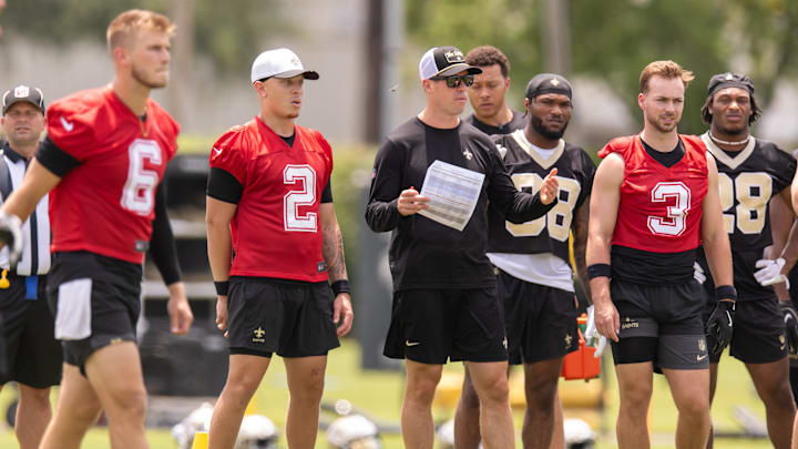Jun 10, 2025; New Orleans, LA, USA; New Orleans Saints quarterback Tyler Shough (6) and quarterback Spencer Rattler (2) and quarterback Jake Haener (3) look on during minicamp at Ochsner Sports Performance Center. Mandatory Credit: Stephen Lew-Imagn Images Jun 10, 2025; New Orleans, LA, USA; New Orleans Saints quarterback Tyler Shough (6) and quarterback Spencer Rattler (2) and quarterback Jake Haener (3) look on during minicamp at Ochsner Sports Performance Center. Mandatory Credit: Stephen Lew-Imagn Images