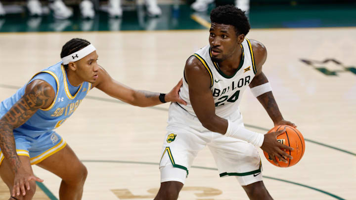Dec 21, 2025; Waco, Texas, USA; Baylor Bears guard Tounde Yessoufou (24) looks to pass against Southern University Jaguars guard Brandon Hardy (4) during the second half at Paul and Alejandra Foster Pavilion.