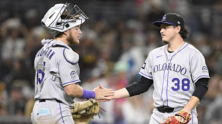 Sep 12, 2025; San Diego, California, USA; Colorado Rockies relief pitcher Victor Vodnik (38) and Hunter Goodman (15) celebrate after the Rockies beat the San Diego Padres at Petco Park. 