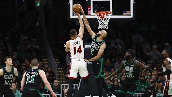 Dec 2, 2024; Boston, Massachusetts, USA; Boston Celtics guard Derrick White (9) blocks a shot by Miami Heat guard Tyler Herro (14) during the second half at TD Garden. Mandatory Credit: Winslow Townson-Imagn Images