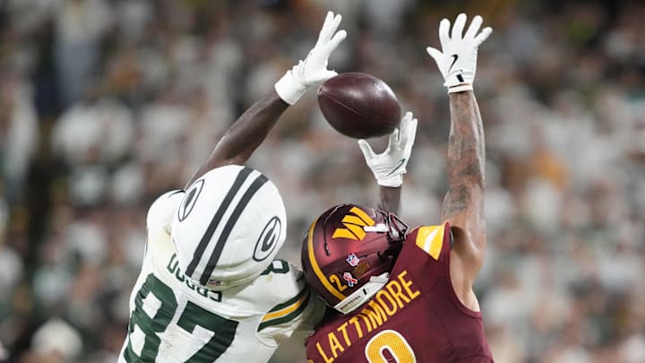 Sep 11, 2025; Green Bay, Wisconsin, USA; Green Bay Packers wide receiver Romeo Doubs (87) cannot make a catch against Washington Commanders cornerback Marshon Lattimore (2) in the second quarter at Lambeau Field. Mandatory Credit: Jeff Hanisch-Imagn Images Sep 11, 2025; Green Bay, Wisconsin, USA; Green Bay Packers wide receiver Romeo Doubs (87) cannot make a catch against Washington Commanders cornerback Marshon Lattimore (2) in the second quarter at Lambeau Field. Mandatory Credit: Jeff Hanisch-Imagn Images