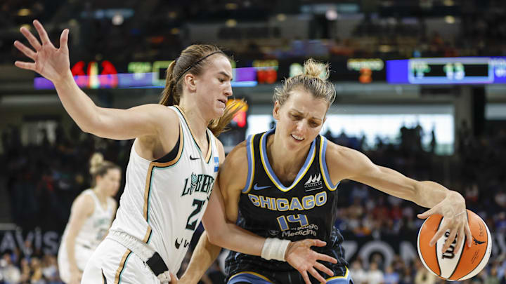 Aug 20, 2022; Chicago, Illinois, USA; Chicago Sky guard Allie Quigley (14) is defended by New York Liberty guard Sabrina Ionescu (20) during the first half of Game 2 of the first round of the WNBA playoffs at Wintrust Arena. Mandatory Credit: Kamil Krzaczynski-Imagn Images