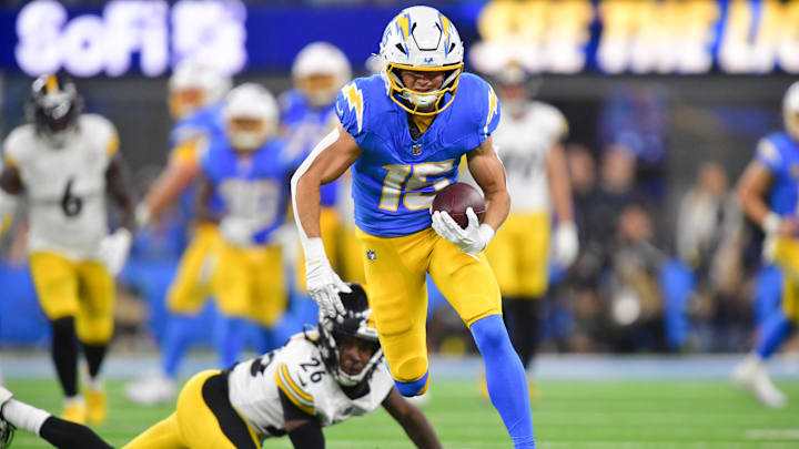 Nov 9, 2025; Inglewood, California, USA; Los Angeles Chargers wide receiver Ladd McConkey (15) carries the ball after a reception against the Pittsburgh Steelers during the fourth quarter of the game at SoFi Stadium. Mandatory Credit: Gary A. Vasquez-Imagn Images