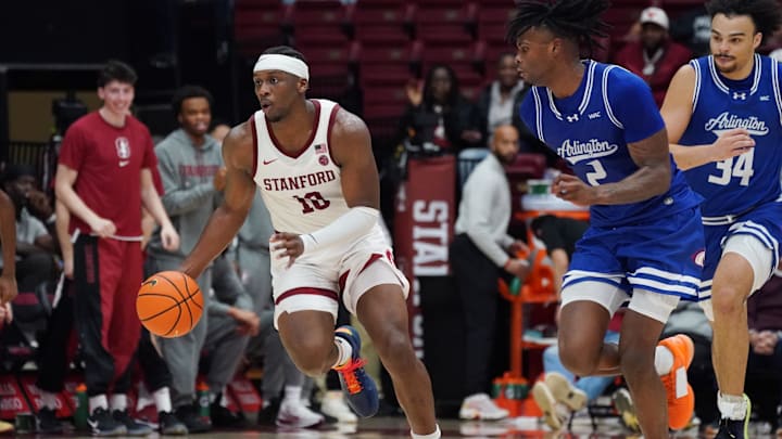 Dec 17, 2025; Stanford, California, USA; Stanford Cardinal forward Chisom Okpara (10) dribbles upcourt while defended by Texas-Arlington Mavericks forward Raysean Seamster (2) and forward/center Cameron Jackson (34) in the first half at Maples Pavilion. Mandatory Credit: David Gonzales-Imagn Images Dec 17, 2025; Stanford, California, USA; Stanford Cardinal forward Chisom Okpara (10) dribbles upcourt while defended by Texas-Arlington Mavericks forward Raysean Seamster (2) and forward/center Cameron Jackson (34) in the first half at Maples Pavilion. Mandatory Credit: David Gonzales-Imagn Images