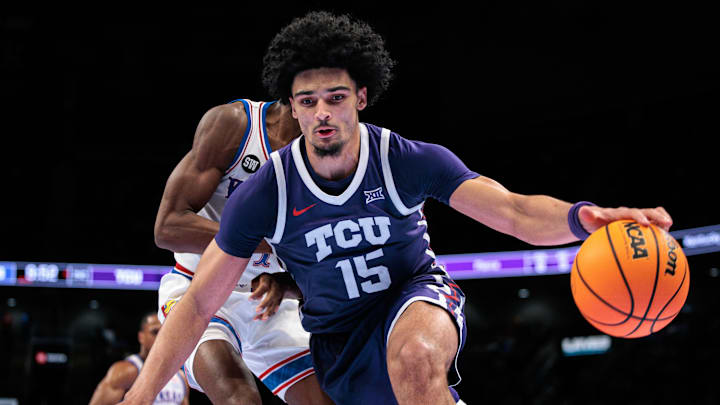 Mar 12, 2026; Kansas City, MO, USA; TCU Horned Frogs forward David Punch (15) drives to the basket during the second half against the Kansas Jayhawks at T-Mobile Center. Mandatory Credit: William Purnell-Imagn Images