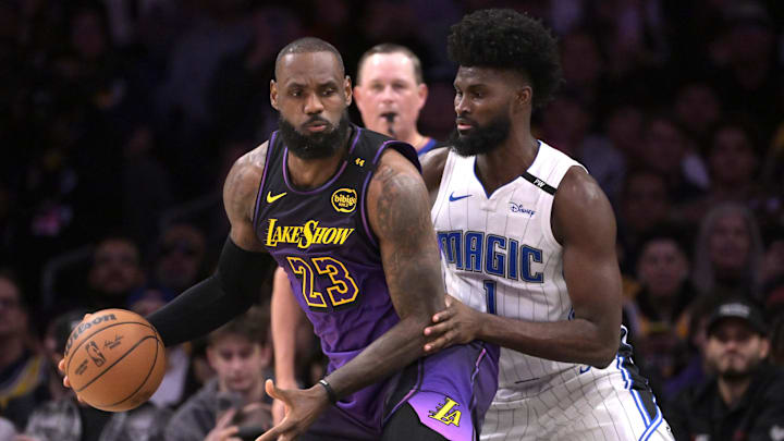 Los Angeles Lakers forward LeBron James (23) is defended by Orlando Magic forward Jonathan Isaac (1) in the first half at Crypto.com Arena.