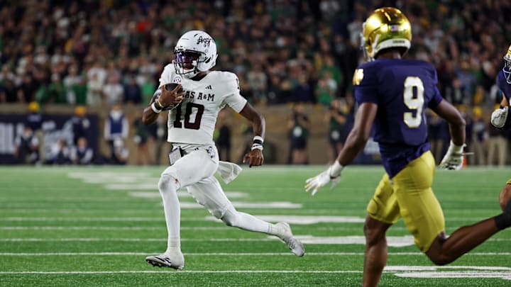 Sep 13, 2025; South Bend, Indiana, USA; Texas A&M Aggies quarterback Marcel Reed (10) runs the ball as Notre Dame Fighting Irish safety Tae Johnson (9) defends during the second half at Notre Dame Stadium. Mandatory Credit: Trevor Ruszkowski-Imagn Images Sep 13, 2025; South Bend, Indiana, USA; Texas A&M Aggies quarterback Marcel Reed (10) runs the ball as Notre Dame Fighting Irish safety Tae Johnson (9) defends during the second half at Notre Dame Stadium. Mandatory Credit: Trevor Ruszkowski-Imagn Images