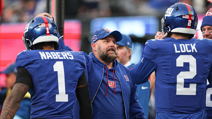 Dec 29, 2024; East Rutherford, New Jersey, USA; New York Giants head coach Brian Daboll congratulates wide receiver Malik Nabers (1) and quarterback Drew Lock (2) after a touchdown during the second half against the Indianapolis Colts at MetLife Stadium. 