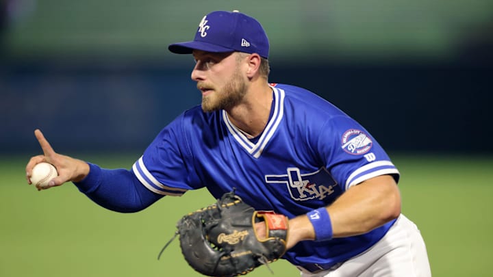 Oklahoma City Dodgers infielder Michael Busch (15) gestures before forcing an out at first base