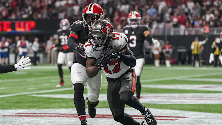 Oct 3, 2024; Atlanta, Georgia, USA; Tampa Bay Buccaneers wide receiver Sterling Shepard (17) catches a touchdown pass behind Atlanta Falcons cornerback Antonio Hamilton Sr. (33) during the first half at Mercedes-Benz Stadium. Mandatory Credit: Dale Zanine-Imagn Images