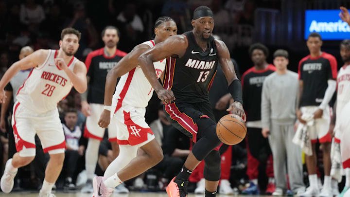 Mar 21, 2025; Miami, Florida, USA;  Miami Heat center Bam Adebayo (13) brings the ball up the court against the Houston Rockets in the second half at Kaseya Center. Mandatory Credit: Jim Rassol-Imagn Images
