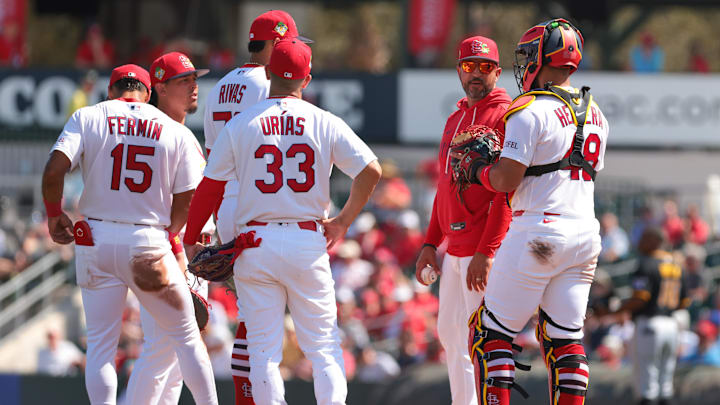 Mar 1, 2026; Jupiter, Florida, USA;  St. Louis Cardinals manager Oliver Marmol (37) speaks to catcher Ivan Herrera (48) during a pitching change against the Pittsburgh Pirates during the third inning at Roger Dean Chevrolet Stadium. Mandatory Credit: Sam Navarro-Imagn Images