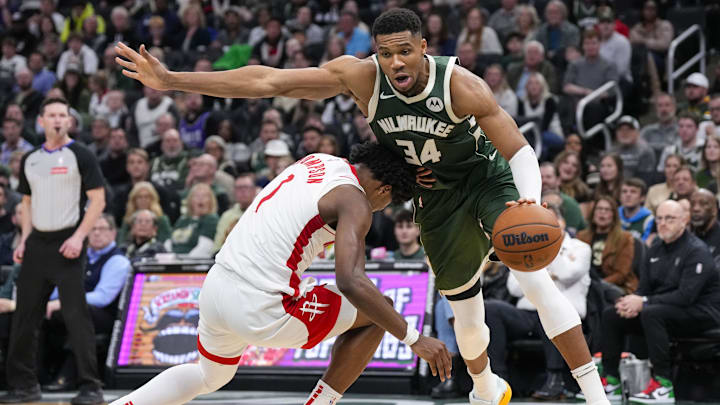Nov 18, 2024; Milwaukee, Wisconsin, USA; Milwaukee Bucks forward Giannis Antetokounmpo (34) fouls Houston Rockets guard Amen Thompson (1) during the fourth quarter at Fiserv Forum. Mandatory Credit: Jeff Hanisch-Imagn Images Nov 18, 2024; Milwaukee, Wisconsin, USA; Milwaukee Bucks forward Giannis Antetokounmpo (34) fouls Houston Rockets guard Amen Thompson (1) during the fourth quarter at Fiserv Forum. Mandatory Credit: Jeff Hanisch-Imagn Images