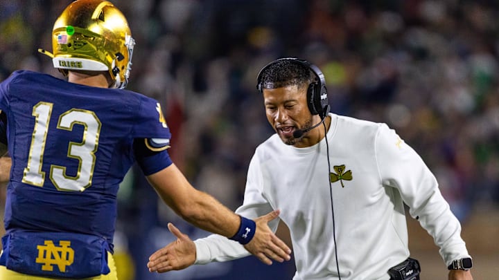 Oct 18, 2025; South Bend, Indiana, USA; Notre Dame Fighting Irish head coach Marcus Freeman celebrates with quarterback CJ Carr (13) during the first half against the Southern California Trojans at Notre Dame Stadium. Mandatory Credit: Michael Caterina-Imagn Images Oct 18, 2025; South Bend, Indiana, USA; Notre Dame Fighting Irish head coach Marcus Freeman celebrates with quarterback CJ Carr (13) during the first half against the Southern California Trojans at Notre Dame Stadium. Mandatory Credit: Michael Caterina-Imagn Images