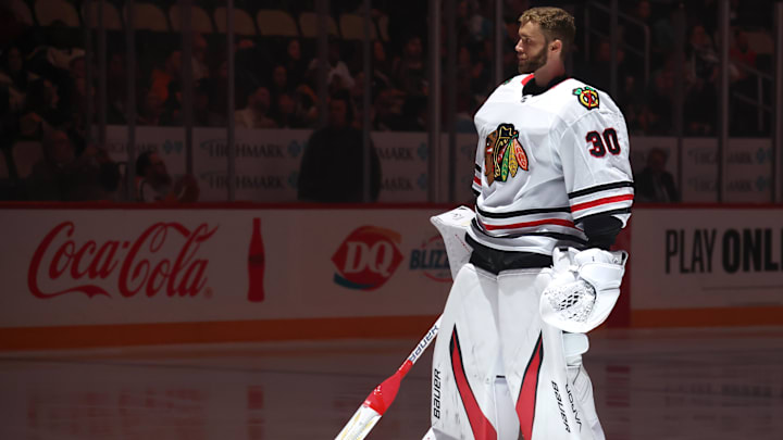 Apr 8, 2025; Pittsburgh, Pennsylvania, USA;  Chicago Blackhawks goaltender Spencer Knight (30) stands for the national anthem against the Pittsburgh Penguins at PPG Paints Arena. Mandatory Credit: Charles LeClaire-Imagn Images