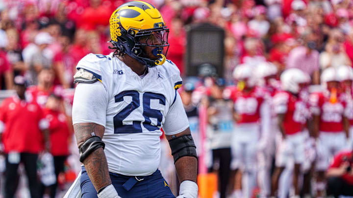 Sep 20, 2025; Lincoln, Nebraska, USA; Michigan Wolverines defensive lineman Rayshaun Benny (26) reacts after a sack against the Nebraska Cornhuskers during the second quarter at Memorial Stadium. Mandatory Credit: Dylan Widger-Imagn Images