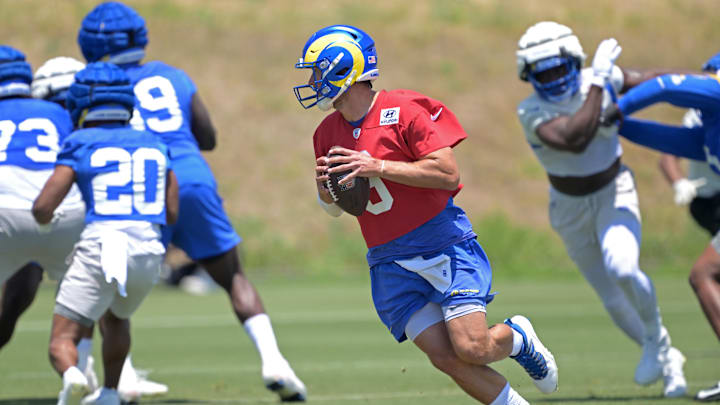 May 28, 2024; Thousand Oaks, CA, USA; Los Angeles Rams quarterback Matthew Stafford (9) looks to pass during OTAs at the team training facility at California Lutheran University. Mandatory Credit: Jayne Kamin-Oncea-USA TODAY Sports