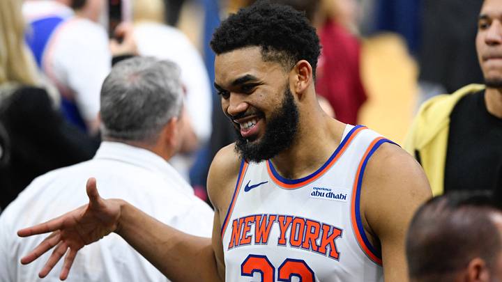 May 23, 2026; Cleveland, Ohio, USA; New York Knicks center Karl-Anthony Towns (32)  high fives teammates after defeating the Cleveland Cavaliers in game three of the eastern conference finals for the 2026 NBA playoffs at Rocket Arena. Mandatory Credit: David Richard-Imagn Images