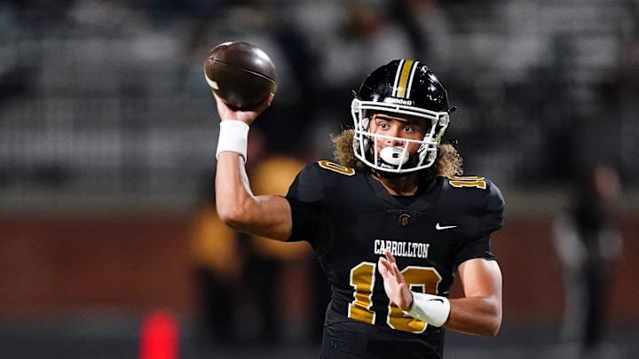 Oct 20, 2023; Carrollton, GA, USA; Carrollton Trojans quarterback Julian Lewis (10) passing against the Westlake Lions during the first half at Grisham Stadium. The 15-year-old Carrollton High student has already committed to playing for the University of Southern California Trojans and has been considered one of the top high school quarterback prospects. Mandatory Credit: John David Mercer-Imagn Images