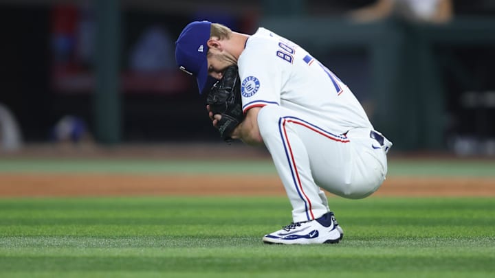 May 14, 2025; Arlington, Texas, USA; Texas Rangers pitcher Caleb Boushley (70) gets ready to pitch during the seventh inning against the Colorado Rockies at Globe Life Field.