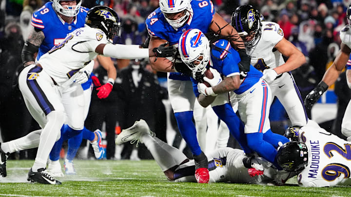 Jan 19, 2025; Orchard Park, New York, USA; Buffalo Bills running back James Cook (4) runs the ball during the fourth quarter against the Baltimore Ravens in a 2025 AFC divisional round game at Highmark Stadium