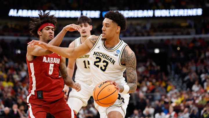 Mar 27, 2026; Chicago, IL, USA; Michigan Wolverines forward Yaxel Lendeborg (23) drives the ball while defended by Alabama Crimson Tide forward Amari Allen (5) during a Sweet Sixteen game of the Midwest Regional of the men's 2026 NCAA Tournament at United Center. Mandatory Credit: Kamil Krzaczynski-Imagn Images Mar 27, 2026; Chicago, IL, USA; Michigan Wolverines forward Yaxel Lendeborg (23) drives the ball while defended by Alabama Crimson Tide forward Amari Allen (5) during a Sweet Sixteen game of the Midwest Regional of the men's 2026 NCAA Tournament at United Center. Mandatory Credit: Kamil Krzaczynski-Imagn Images