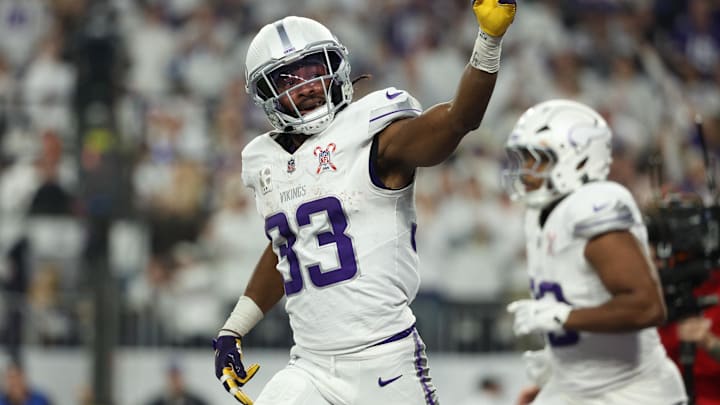 Dec 25, 2025; Minneapolis, Minnesota, USA; Minnesota Vikings running back Aaron Jones Sr. (33) celebrates after scoring a touchdown against the Detroit Lions in the first quarter at U.S. Bank Stadium.