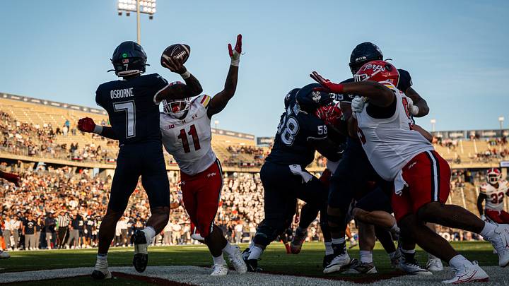 Maryland Terrapins linebacker Sidney Stewart (11) defends against UConn Huskies quarterback Kalieb Osborne (7) in the second half at Rentschler Field. Maryland Terrapins linebacker Sidney Stewart (11) defends against UConn Huskies quarterback Kalieb Osborne (7) in the second half at Rentschler Field.