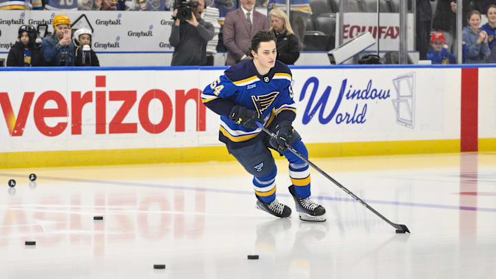 Mar 23, 2025; St. Louis, Missouri, USA;  St. Louis Blues center Dalibor Dvorsky (54) skates during his rookie lap before his first NHL game against the Nashville Predators at Enterprise Center. Mandatory Credit: Jeff Curry-Imagn Images