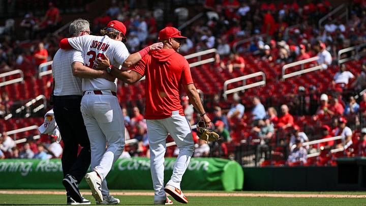 Aug 27, 2026; St. Louis, Missouri, USA; St. Louis Cardinals third baseman Blaze Jordan (33) is helped off the field by a trainer and manager Oliver Marmol (37) after injuring his ankle on a tag play at third base against the Baltimore Orioles during the eighth inning at Busch Stadium. Mandatory Credit: Jeff Curry-Imagn Images Aug 27, 2026; St. Louis, Missouri, USA; St. Louis Cardinals third baseman Blaze Jordan (33) is helped off the field by a trainer and manager Oliver Marmol (37) after injuring his ankle on a tag play at third base against the Baltimore Orioles during the eighth inning at Busch Stadium. Mandatory Credit: Jeff Curry-Imagn Images