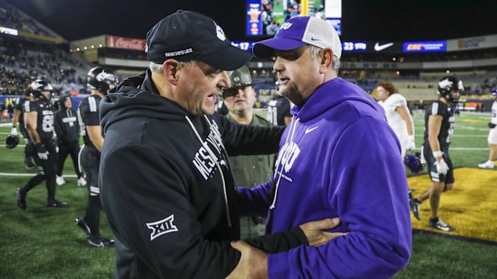 Oct 25, 2025; Morgantown, West Virginia, USA; West Virginia Mountaineers head coach Rich Rodriguez talks with Texas Christian University Horned Frogs head coach Sonny Dykes after the game at Milan Puskar Stadium. Mandatory Credit: Ben Queen-Imagn Images Oct 25, 2025; Morgantown, West Virginia, USA; West Virginia Mountaineers head coach Rich Rodriguez talks with Texas Christian University Horned Frogs head coach Sonny Dykes after the game at Milan Puskar Stadium. Mandatory Credit: Ben Queen-Imagn Images