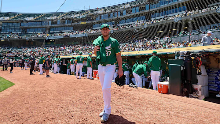 May 26, 2024; Oakland, California, USA; Oakland Athletics pitcher Jack O'Loughlin (37) walks to the bullpen before the start of the game against the Houston Astros at Oakland-Alameda County Coliseum.