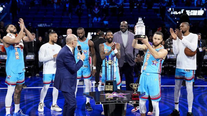 NBA stars gather as Stephen Curry hoists an MVP trophy during the 2025 All-Star Game at Chase Center.
