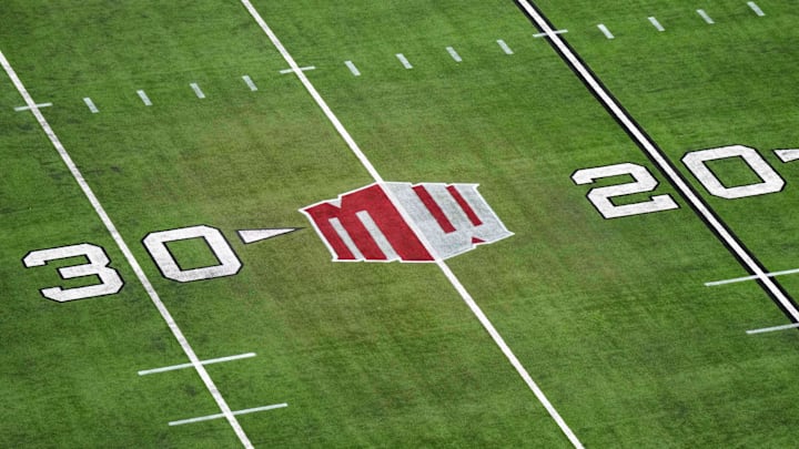 The Mountain West conference logo on the field at Allegiant Stadium. Mandatory Credit: Kirby Lee-Imagn Images The Mountain West conference logo on the field at Allegiant Stadium. Mandatory Credit: Kirby Lee-Imagn Images