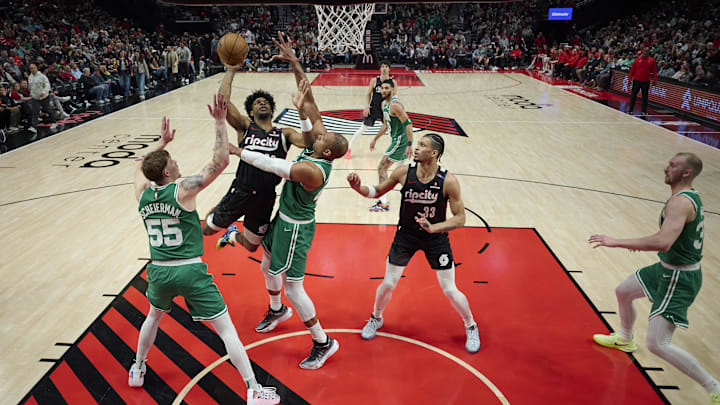 Mar 23, 2025; Portland, Oregon, USA; Portland Trail Blazers guard Scoot Henderson (00) drives to the basket during the second half against Boston Celtics center Al Horford (42) and forward Baylor Scheierman (55) at Moda Center. Mandatory Credit: Troy Wayrynen-Imagn Images Mar 23, 2025; Portland, Oregon, USA; Portland Trail Blazers guard Scoot Henderson (00) drives to the basket during the second half against Boston Celtics center Al Horford (42) and forward Baylor Scheierman (55) at Moda Center. Mandatory Credit: Troy Wayrynen-Imagn Images