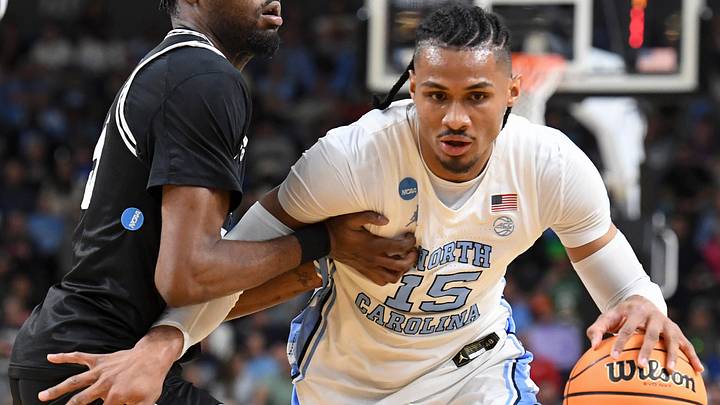 VCU Rams forward Barry Evans (5) defends North Carolina Tar Heels forward Jarin Stevenson (15) Thursday, March 19, 2026, during the NCAA Men’s Basketball Tournament first round game at Bon Secours Wellness Arena in Greenville, South Carolina.