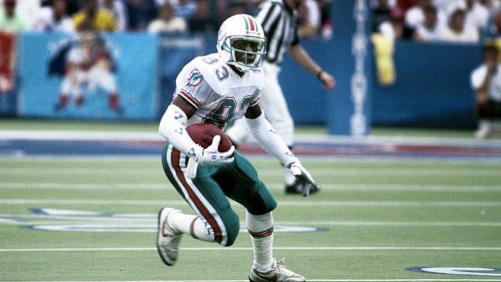 Miami Dolphins receiver Mark Clayton (83) in action against the New England Patriots at Foxboro Stadium in 1989.