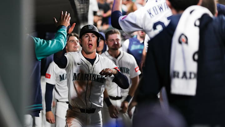Seattle Mariners pinch-runner Dylan Moore celebrates after scoring a run against the Cleveland Guardians on June 14 at T-Mobile Park. Seattle Mariners pinch-runner Dylan Moore celebrates after scoring a run against the Cleveland Guardians on June 14 at T-Mobile Park.