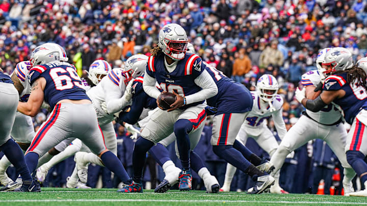 Jan 5, 2025; Foxborough, Massachusetts, USA; New England Patriots quarterback Joe Milton III (19) ready to hand off the ball against the Buffalo Bills in the second half at Gillette Stadium. Mandatory Credit: David Butler II-Imagn Images