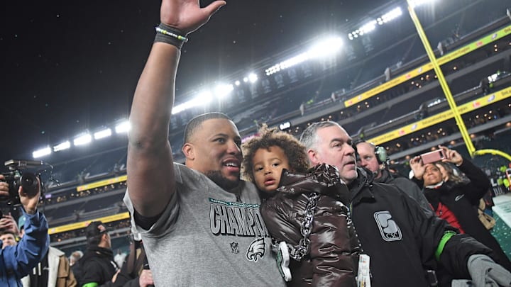 Jan 26, 2025: Saquon Barkley waving to the crowd holding his son, Saquon Jr.