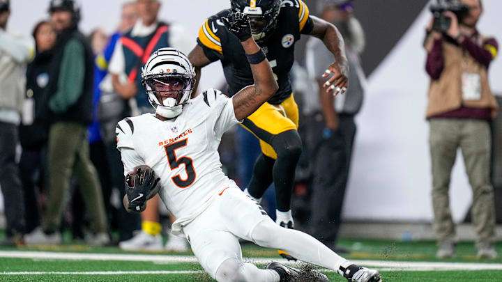 Cincinnati Bengals wide receiver Tee Higgins (5) slides short of the end zone to run time off the clock late in the fourth quarter of the NFL Week 7 game between the Cincinnati Bengals and the Pittsburgh Steelers at Paycor Stadium in downtown Cincinnati on Thursday, Oct. 16, 2025. The Bengals won, 33-31. Cincinnati Bengals wide receiver Tee Higgins (5) slides short of the end zone to run time off the clock late in the fourth quarter of the NFL Week 7 game between the Cincinnati Bengals and the Pittsburgh Steelers at Paycor Stadium in downtown Cincinnati on Thursday, Oct. 16, 2025. The Bengals won, 33-31.