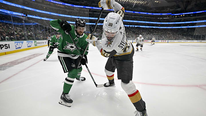 May 5, 2024; Dallas, Texas, USA; Dallas Stars center Sam Steel (18) and Vegas Golden Knights center Chandler Stephenson (20) battle for control of the puck during the first period in game seven of the first round of the 2024 Stanley Cup Playoffs at American Airlines Center. Mandatory Credit: Jerome Miron-Imagn Images
